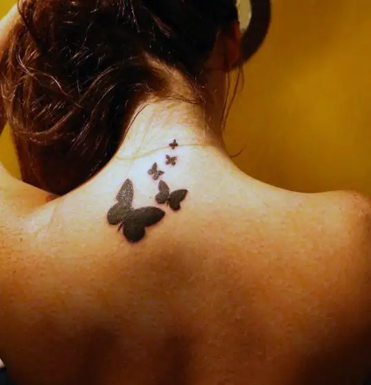 Jet Black Multiple Butterfly Neck Tattoo