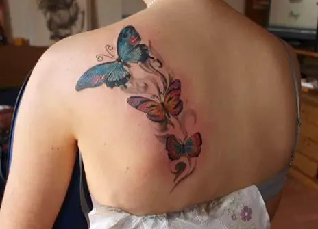 Vibrant And Colorful Butterfly Neck Tattoo